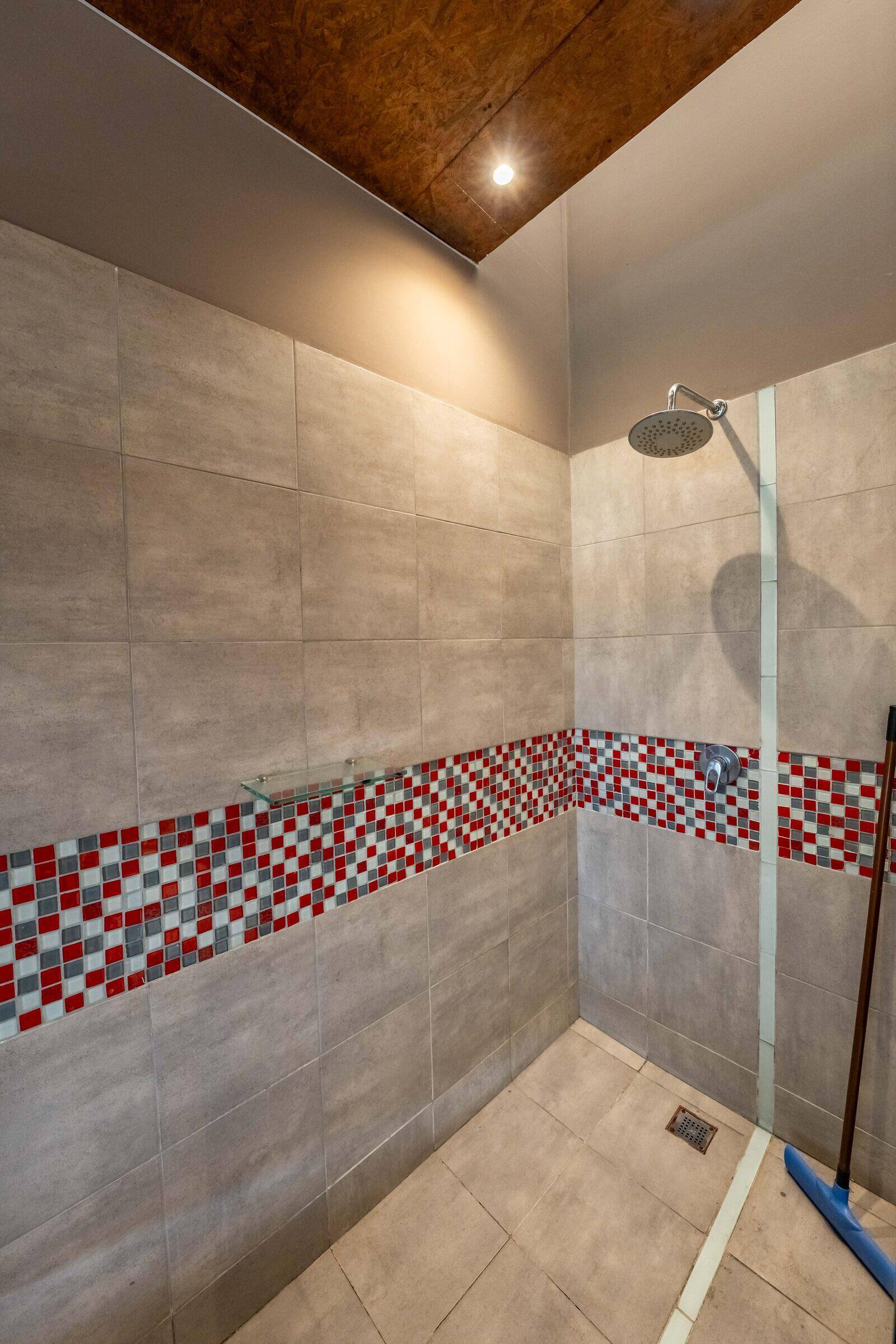 Rainfall shower with a mosaic border in the studio
